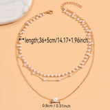 Το σετ κολιέ Trinity Pearl Layer