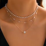 Το σετ κολιέ Trinity Pearl Layer
